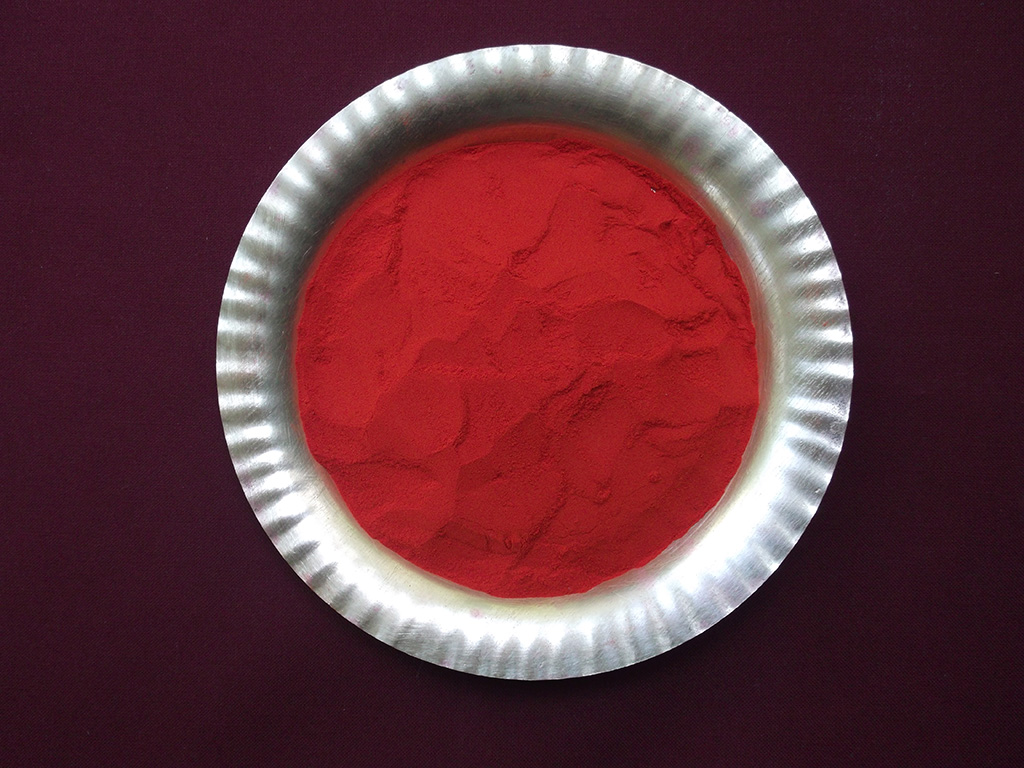 Trichoornam powder shown in a brass tray.