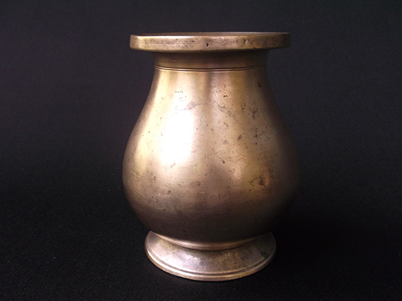 Antique Brass Drinking Pot. Size: Height 4.7”, Width at Bottom 3-2” Diameter, Width at the Belly 4.0” Diameter and Width at the Mouth 3.0” Diameter.