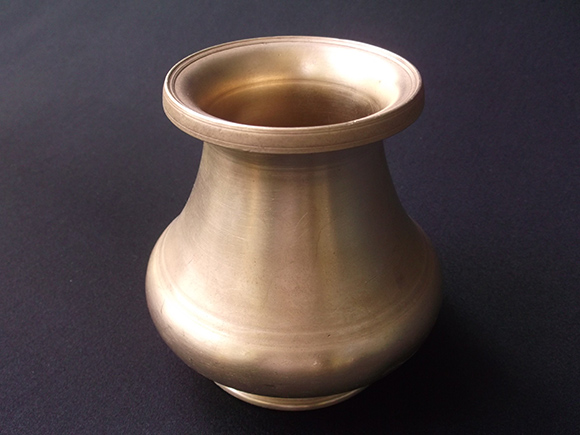 Top-view of Antique Brass Drinking Pot. Size: Height 4.5”, Width at Bottom 3-3” Diameter, Width at the Belly 4.8” Diameter and Width at the Mouth 3.3” Diameter.
