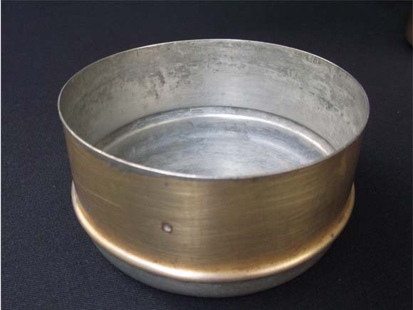 Brass tiffin box showing the inside tin coating 