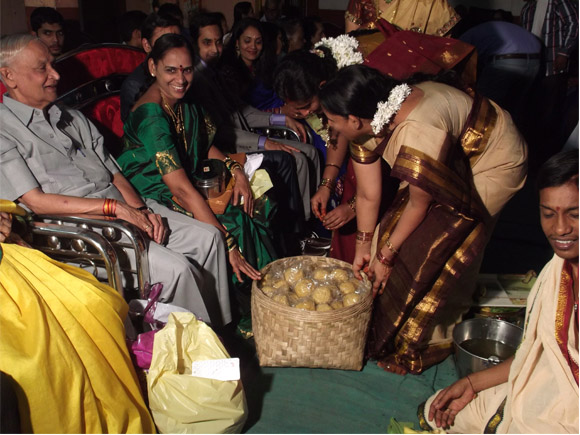 Marriage function bride’s family gifting sweet laddus to groom's family