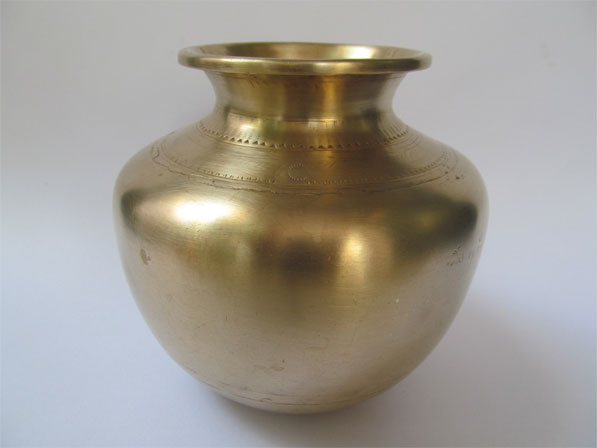 The antique fire walking brass pot.
