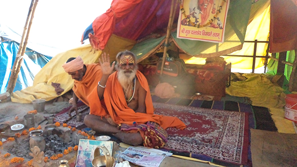 Sadhu blessing the pilgrims