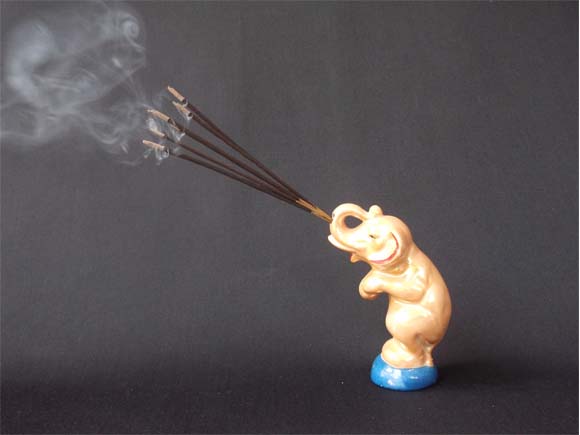 Antique elephant incense stick holder-with burning sticks and curls of smoke