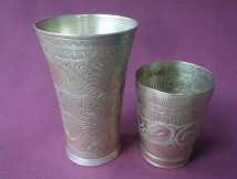 Large and small brass lassi glasses shown together.