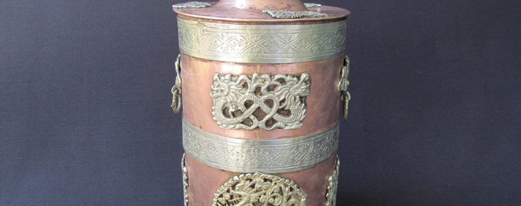 Mystical copper vessel with 3 white metal strips, dragon embellishments and the lid with the knob